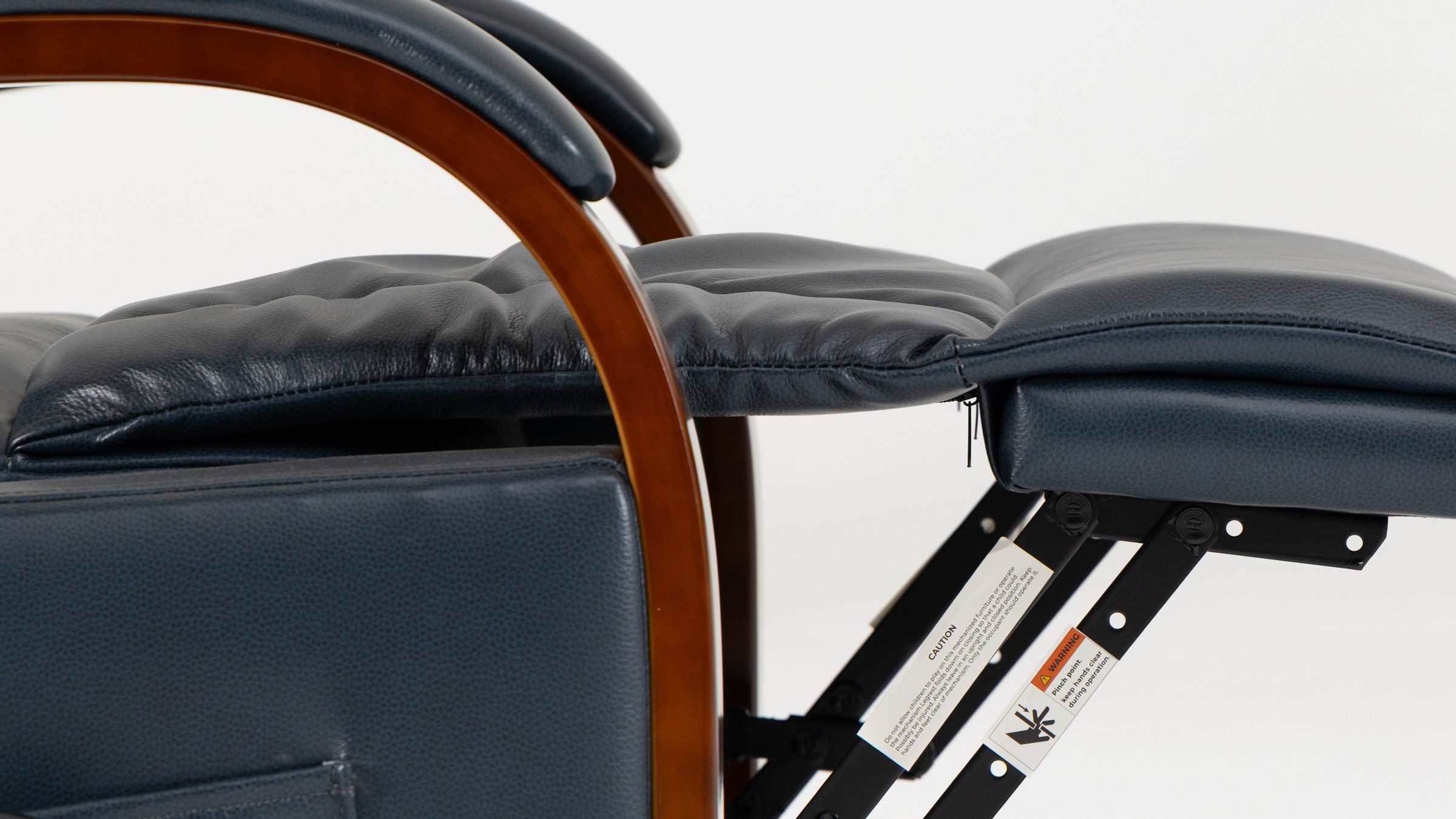 Close-up of the single curved solid wood armrest running over the padded leather arm of the Irene House 9185