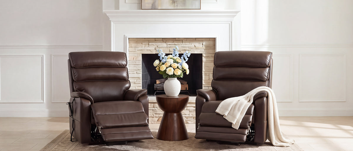 Two Irene House 9188T tall power lift recliners in caramel leather in a bright living room, footrests raised