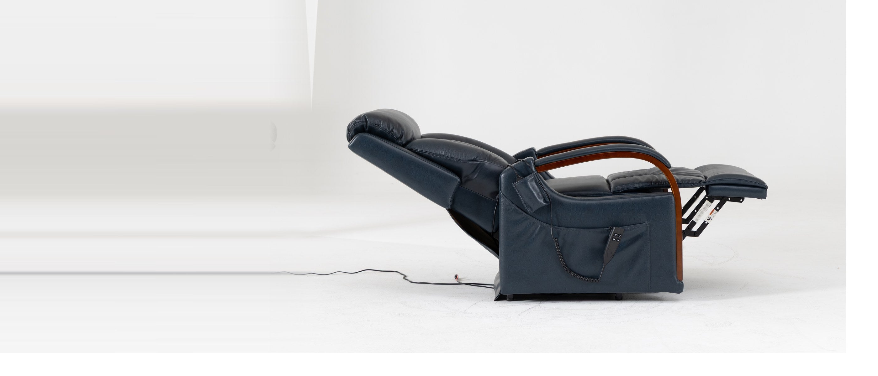 Irene House 9185 small power lift recliner in dark blue top grain leather, reclined from the side with the footrest raised and solid wood arms visible
