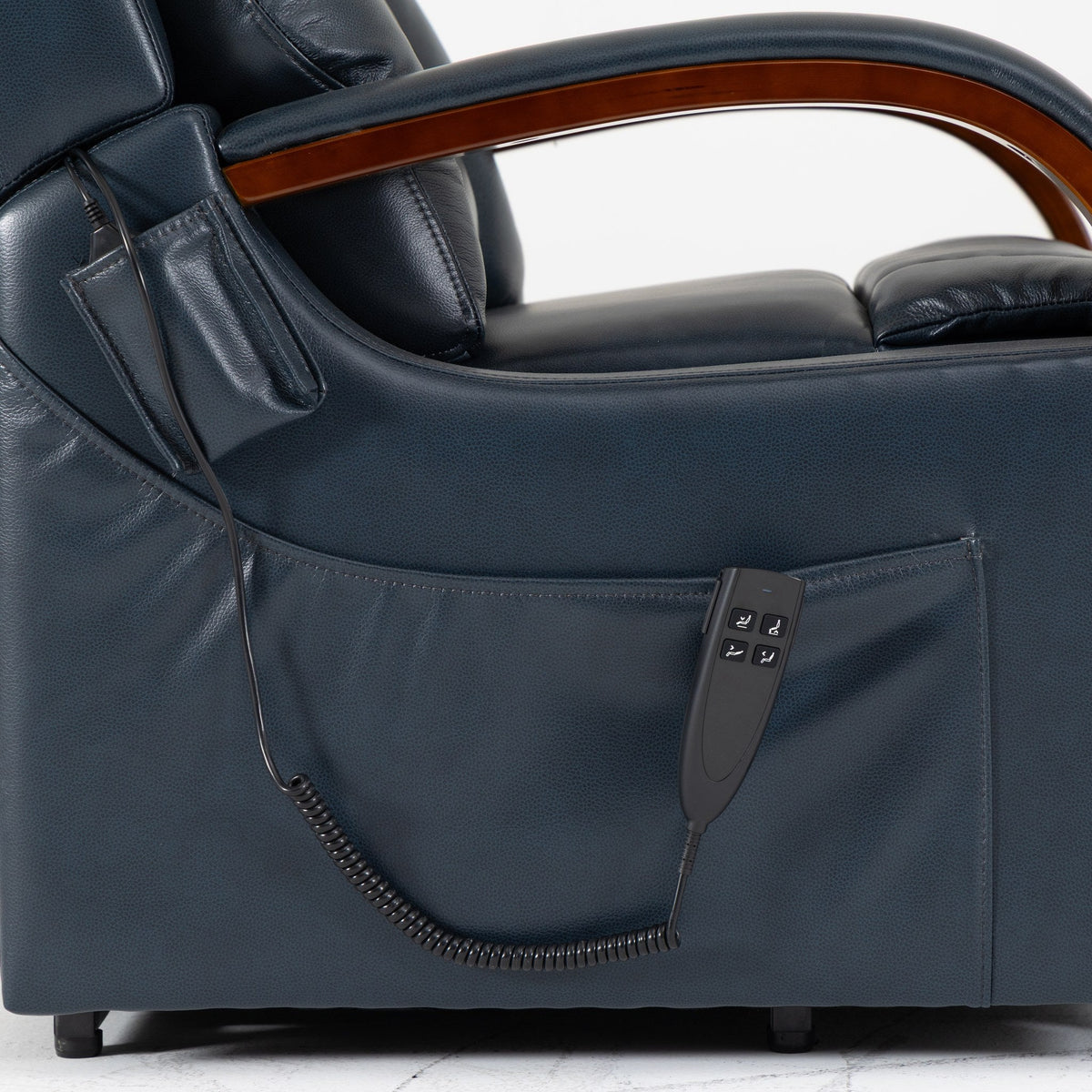 Side pocket and wired hand control on the dark blue leather side panel of the Irene House 9185 lift recliner