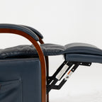 Close-up of the solid wood armrest arch over the padded dark blue leather arm on the Irene House 9185