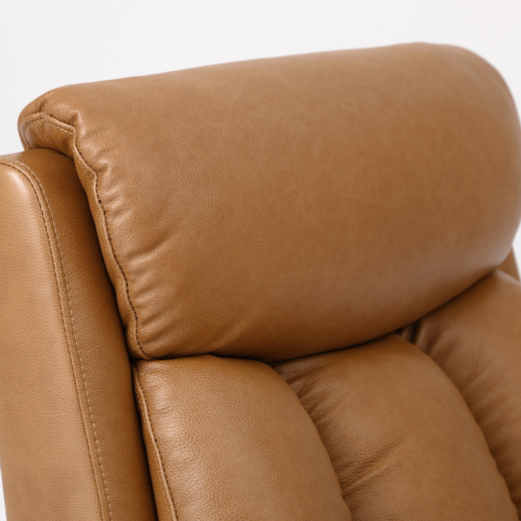 Close-up of the camel brown top grain leather on the Irene House 9185 backrest and headrest