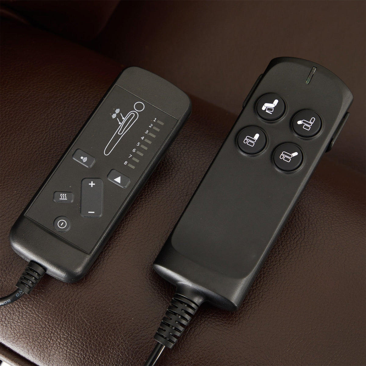 The two hand controls of the Irene House 9188 EWT500 — separate backrest, footrest and lift buttons plus heat and massage controls