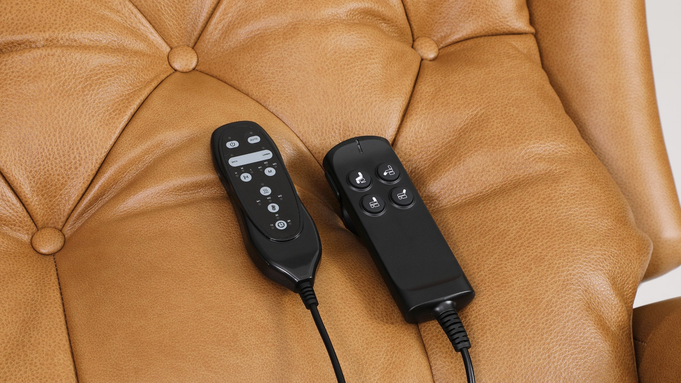 The two Irene House 9199 handsets resting on the button-tufted camel top grain leather seat