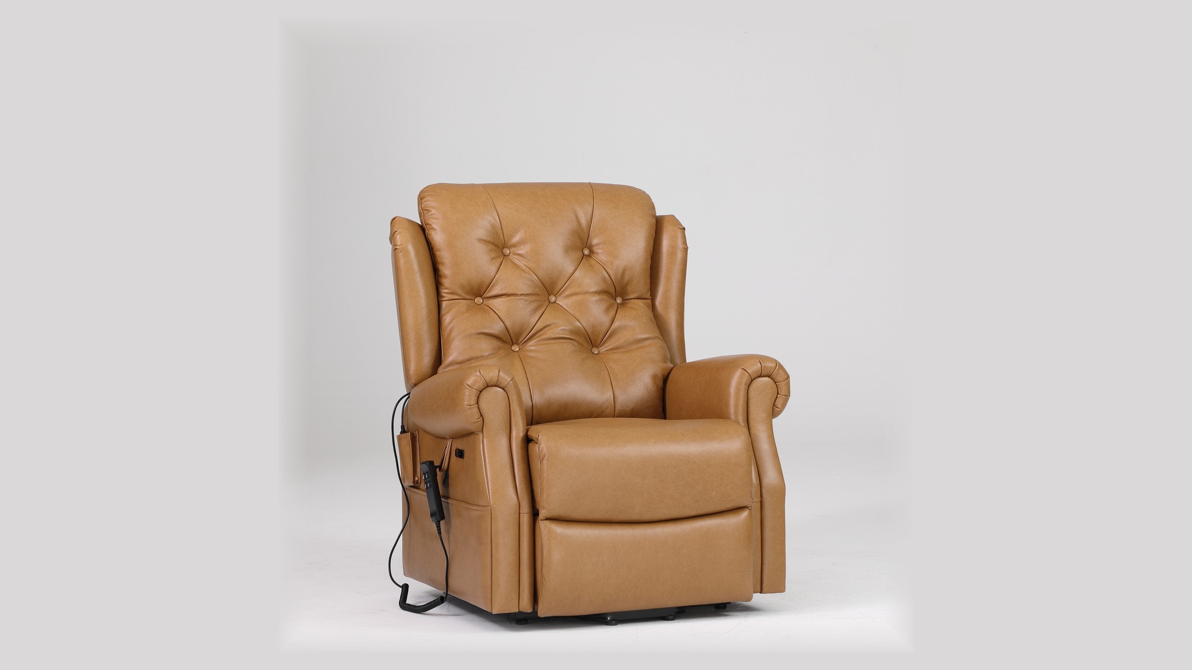 Irene House 9199 camel top grain leather lift recliner shown from a three-quarter angle, button-tufted wingback and rolled arms visible
