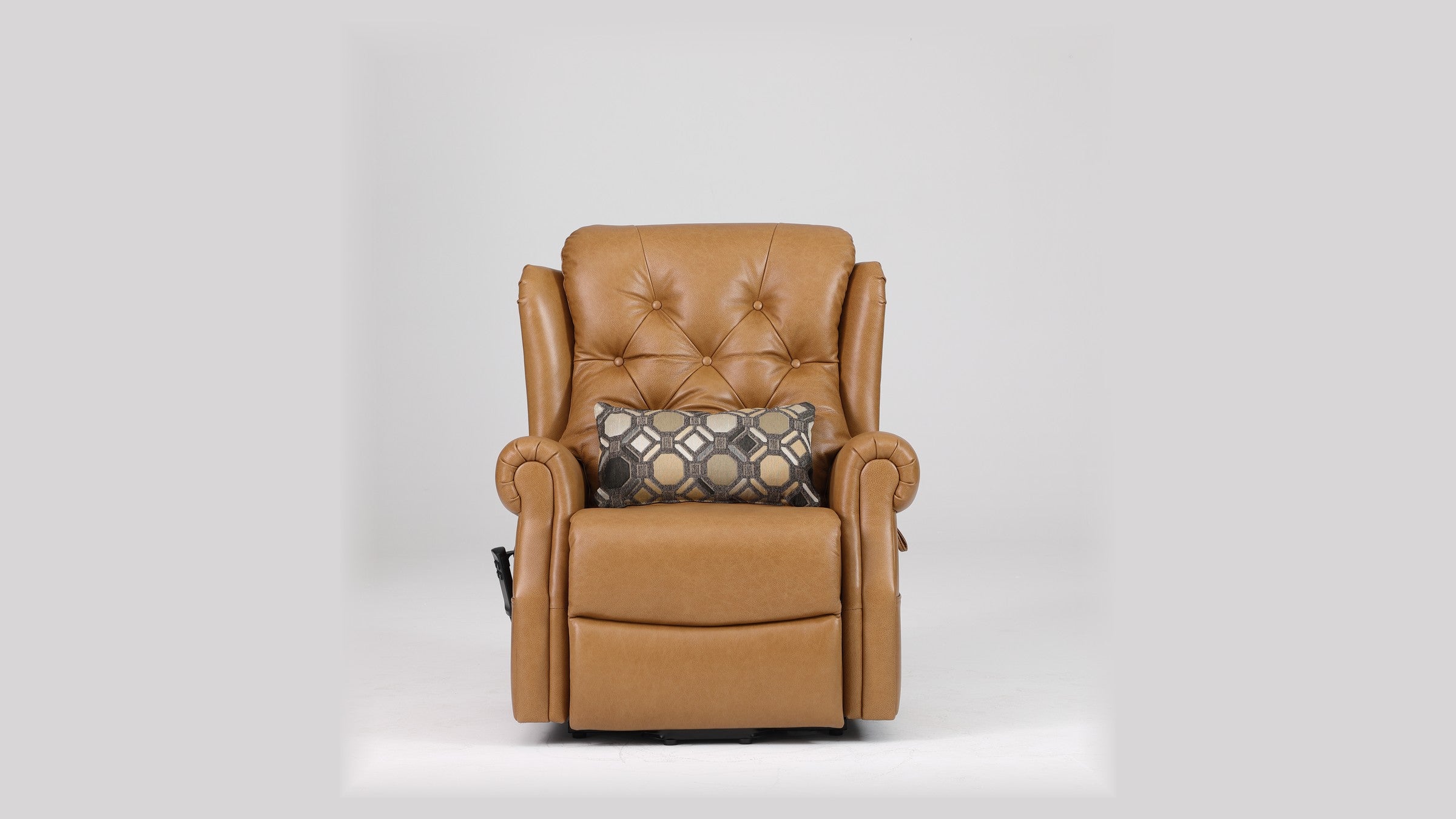 Irene House 9199 camel top grain leather recliner shown with the included patterned toss pillow on the seat