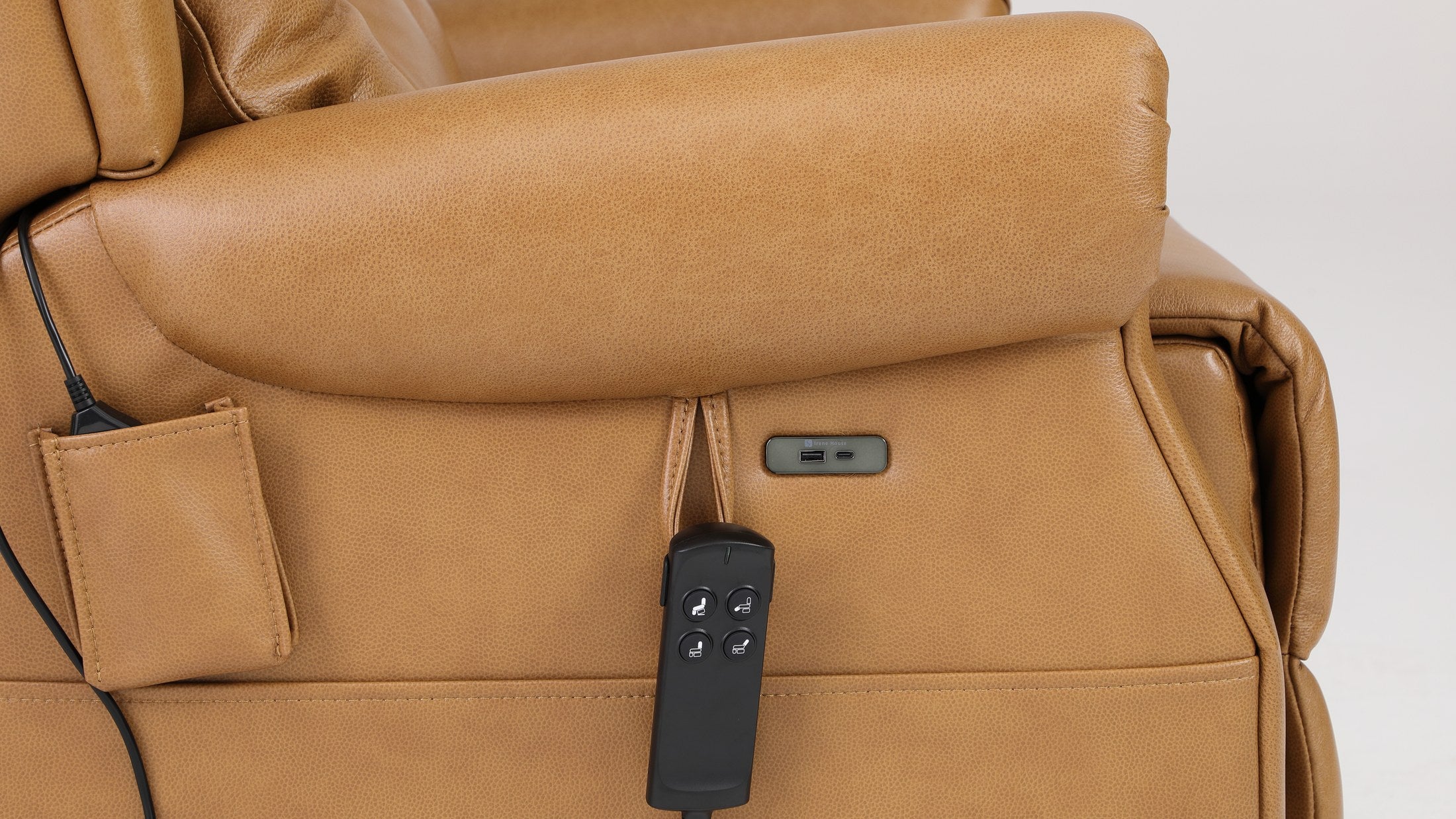 Side pocket, USB port and handset on the camel top grain leather side panel of the Irene House 9199