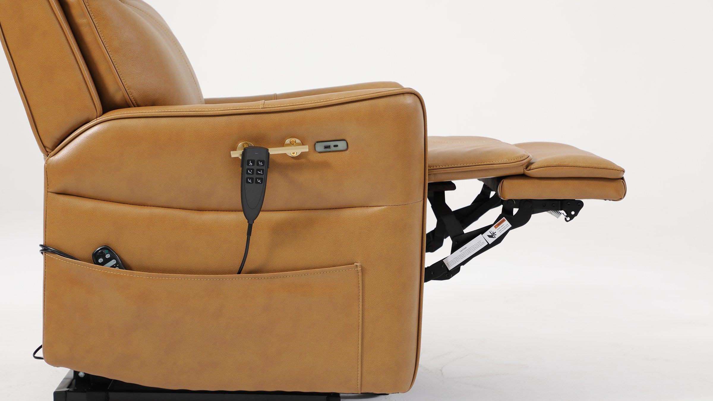Side view of the Irene House 9219 camel brown recliner reclined with the footrest extended, showing the steel lift and recline mechanism under the seat